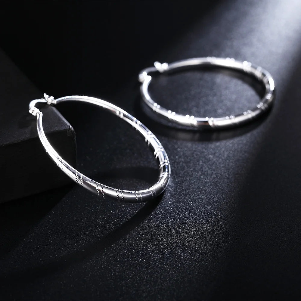 Engraved Sterling Silver Hoop Earrings – Polished Oval Hoops for Women