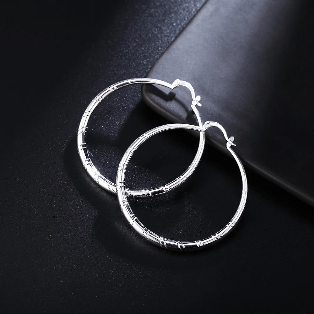 Engraved Sterling Silver Hoop Earrings – Polished Oval Hoops for Women